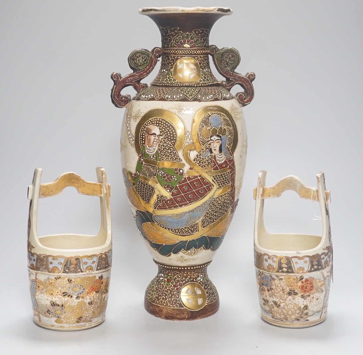 A pair of Japanese Satsuma bucket vases and another vase, 37cm